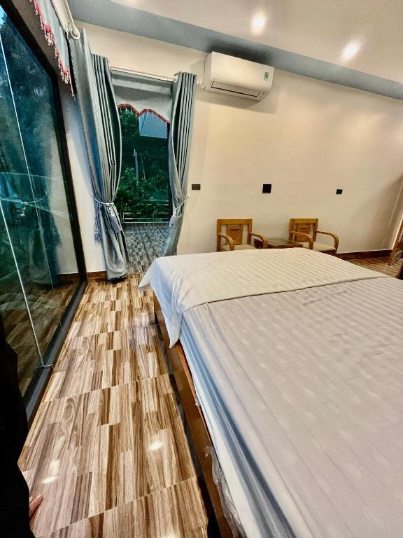 Postel nebo postele na pokoji v ubytování Phong Nha Moonlight Villas