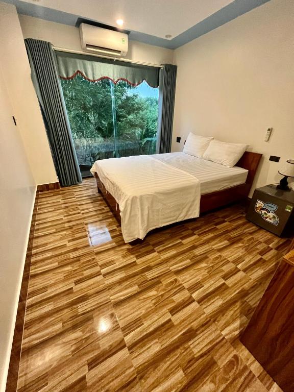 Postel nebo postele na pokoji v ubytování Phong Nha Moonlight Villas