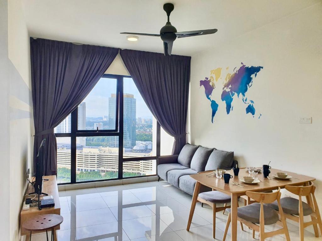 a living room with a couch and a table at Southkey Mosaic Mid Valley Johor Bahru in Johor Bahru
