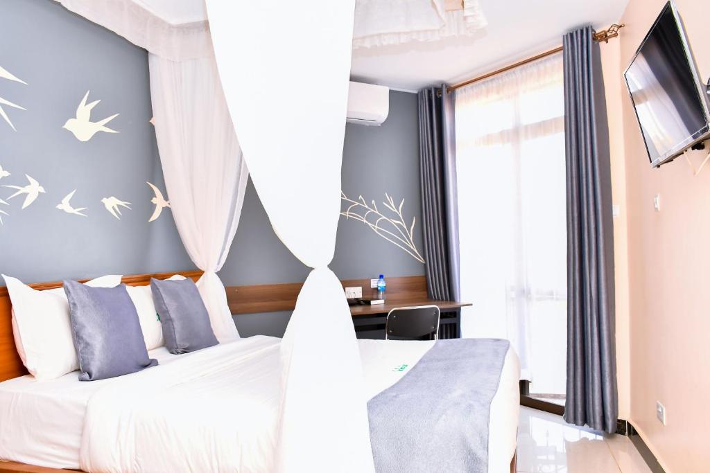 Postel nebo postele na pokoji v ubytování Divine Homes Resort Kisumu