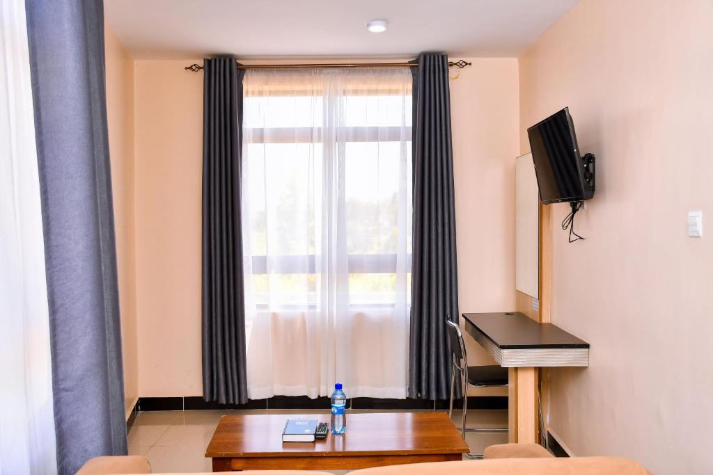 TV a/nebo společenská místnost v ubytování Divine Homes Resort Kisumu