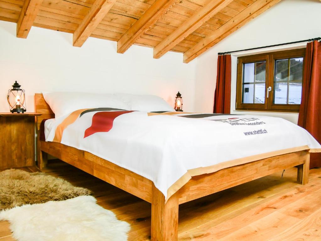 Postel nebo postele na pokoji v ubytování stettli resort