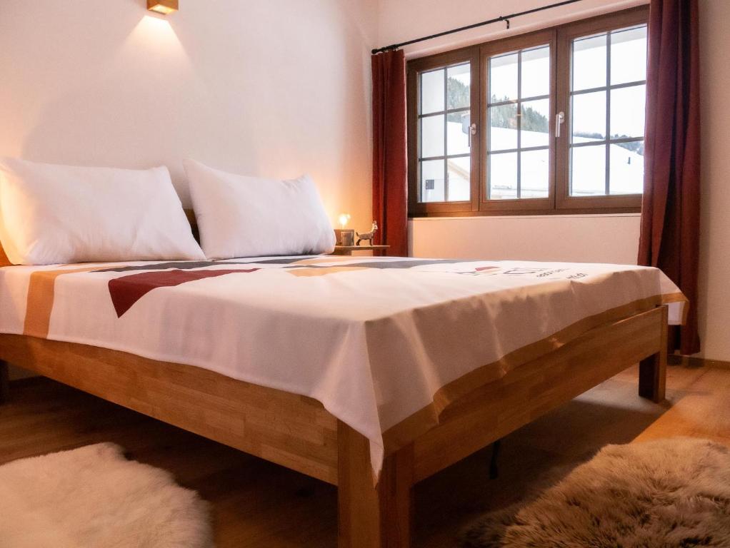 Postel nebo postele na pokoji v ubytování stettli resort