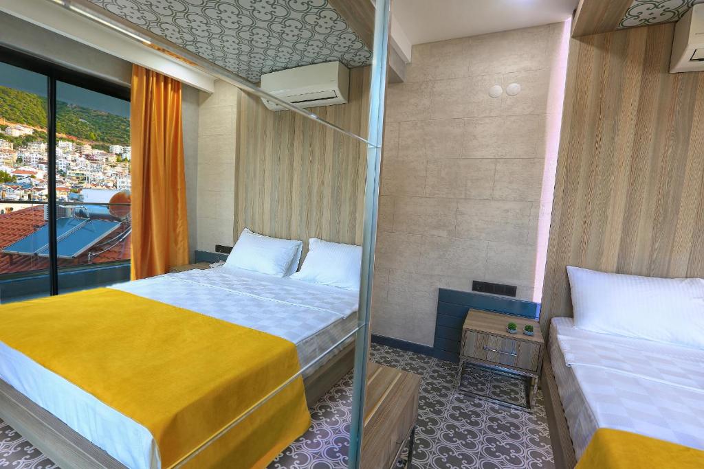 Postel nebo postele na pokoji v ubytování Erdem City Hotel