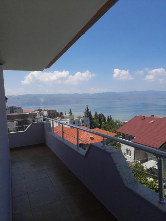 a balcony with a view of the water at Villa Balliu in Pogradec