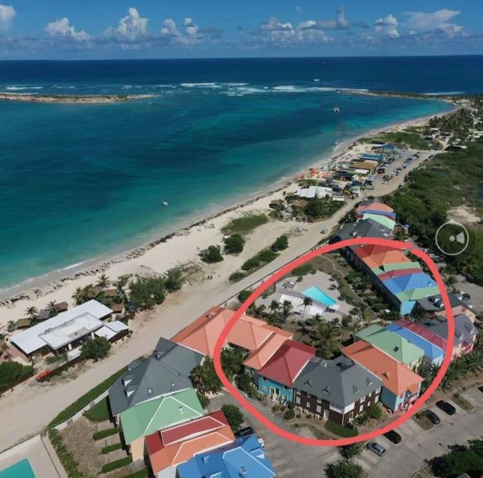 an aerial view of a resort near the beach at Welcome to Baie Orientale plage - 4 personnes - max 6 personnes in Orient Bay