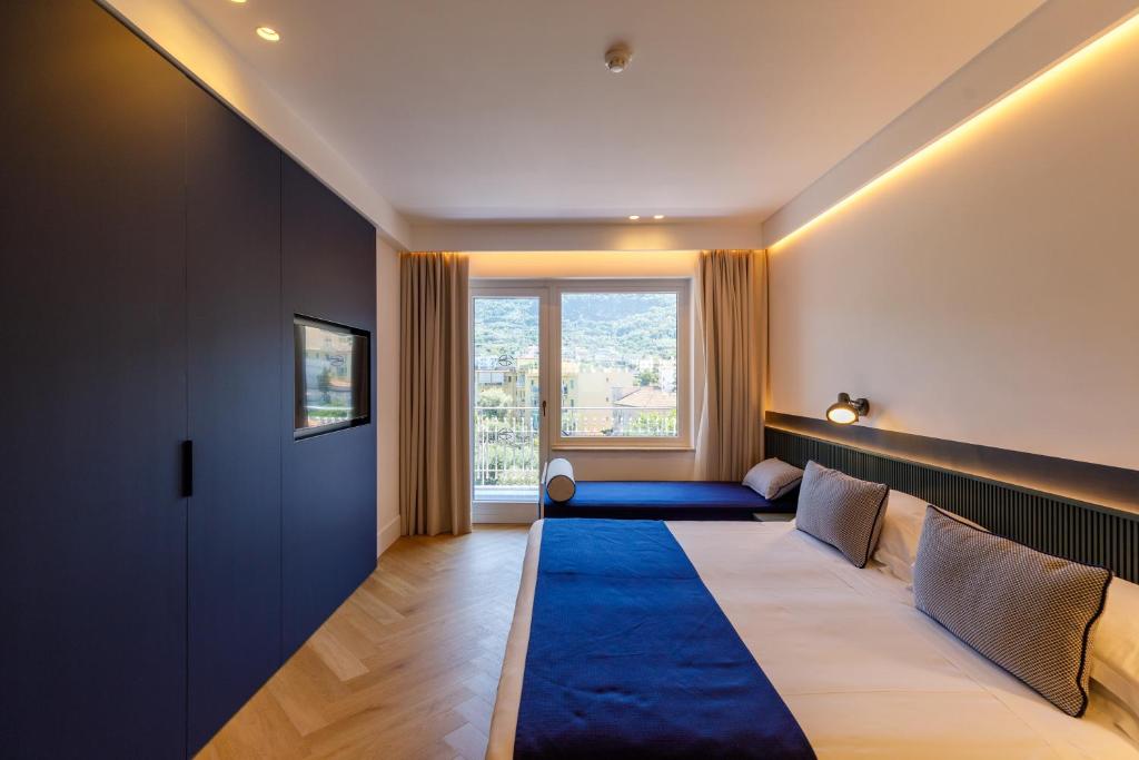 Postel nebo postele na pokoji v ubytování Grand Hotel Cesare Augusto