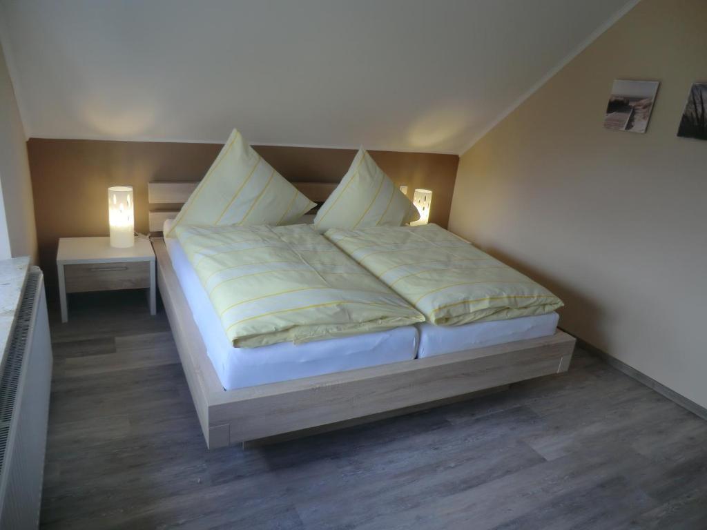 Ένα ή περισσότερα κρεβάτια σε δωμάτιο στο FeWo Brak