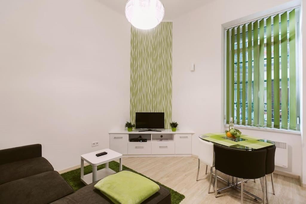 a living room with a couch and a table at Stex Loft Apartment in the city center in Budapest