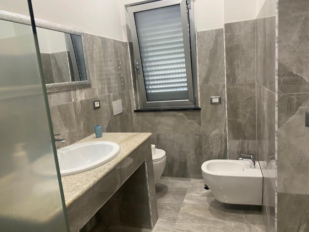 Kúpeľňa v ubytovaní Akoya Rooms Capo Vaticano