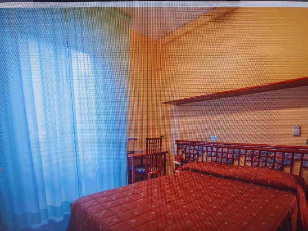 A bed or beds in a room at Fegina 3 DELuxe Bedrooms & Bathrooms