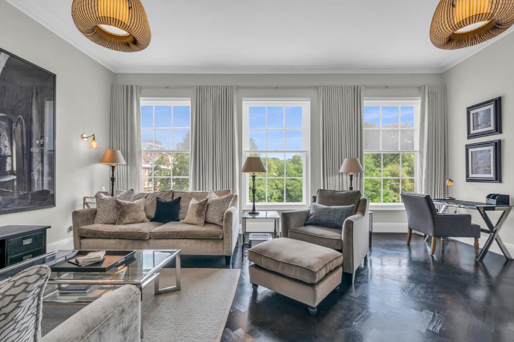 a living room with a couch and chairs and a table at Be London - The Lincoln's Inn Residences in London