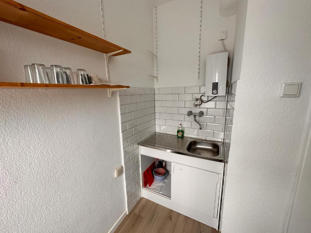 Kuchyň nebo kuchyňský kout v ubytování Apartment City und Stadionnah