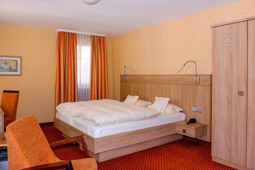 Postel nebo postele na pokoji v ubytování Hotel St.Martiner Castell
