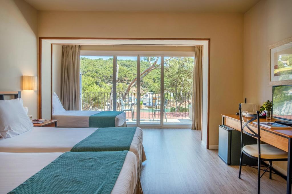 Postel nebo postele na pokoji v ubytování Hotel Hostalillo by Escampa Hotels
