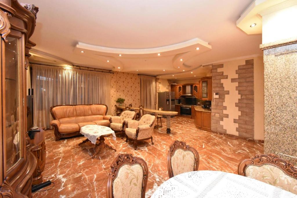 a living room with a couch and a table at Freedom Apartments on Mher Mkrtchyan in Yerevan