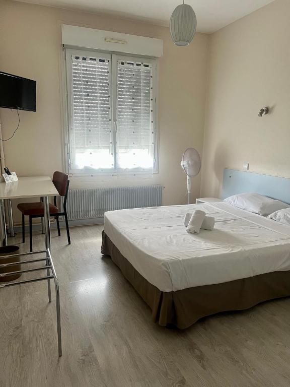 Postel nebo postele na pokoji v ubytování Le Relais de la route bleue