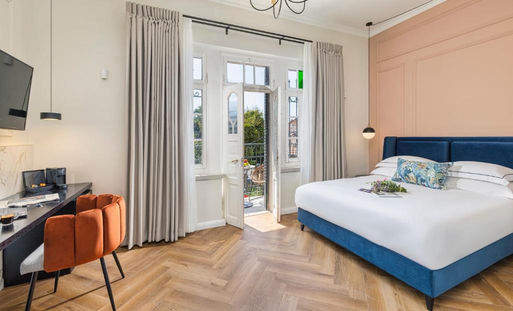 Postel nebo postele na pokoji v ubytování Villa Albi - Machne Yehuda Hotel