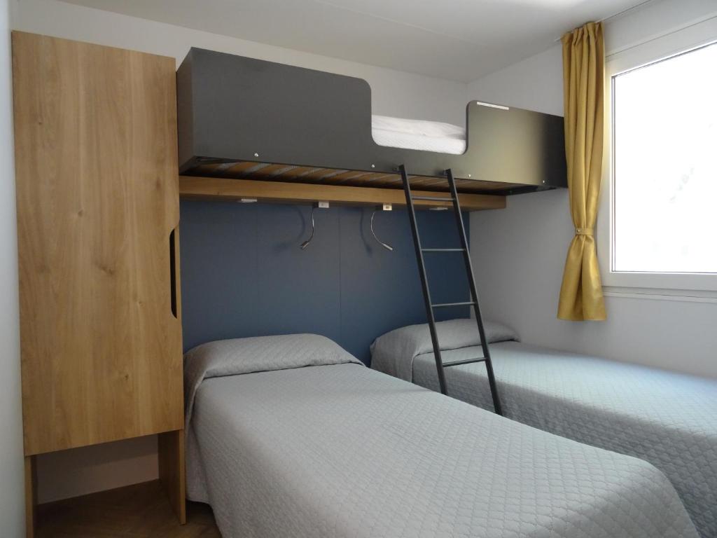 Postel nebo postele na pokoji v ubytování Camping Santin
