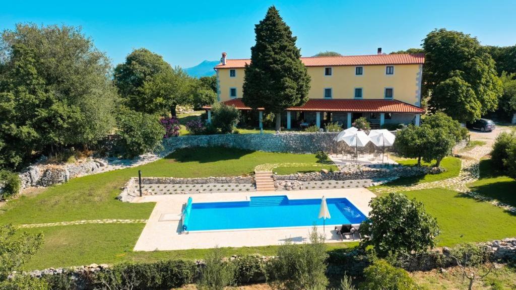 an aerial view of a villa with a swimming pool at Villa Calussovo in Ripenda Kras