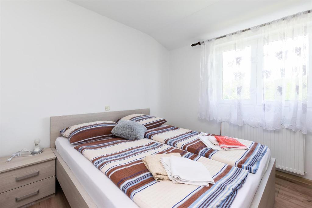 Postel nebo postele na pokoji v ubytování Apartments Boza