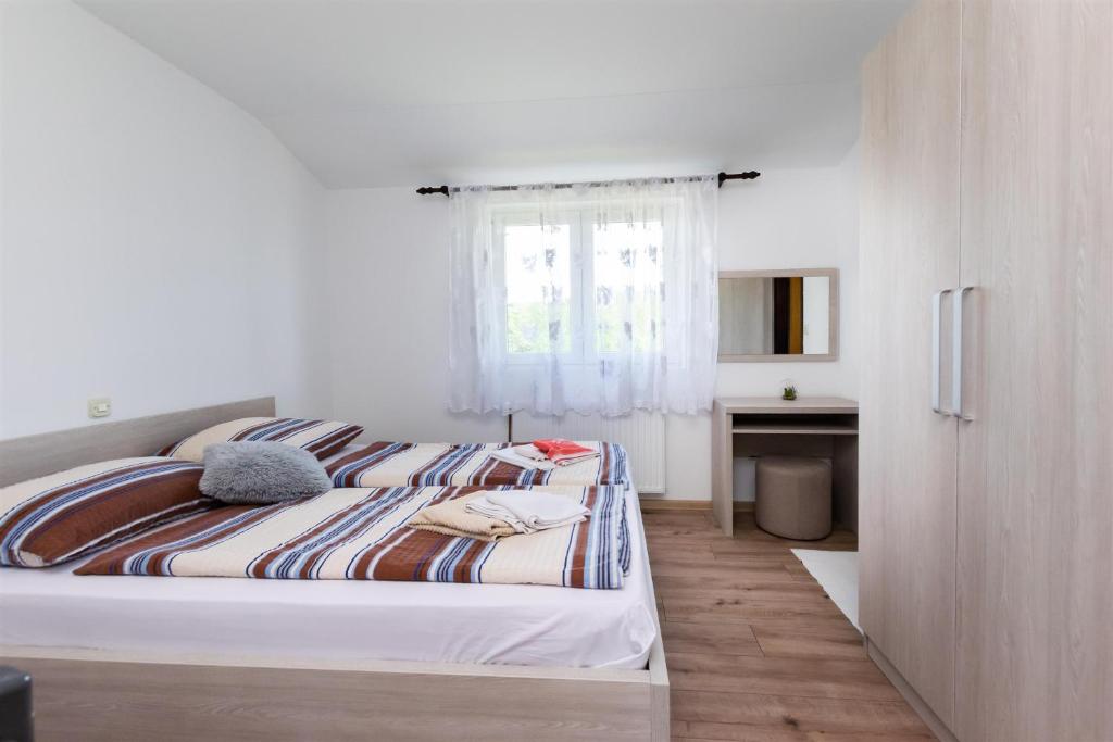 Postel nebo postele na pokoji v ubytování Apartments Boza