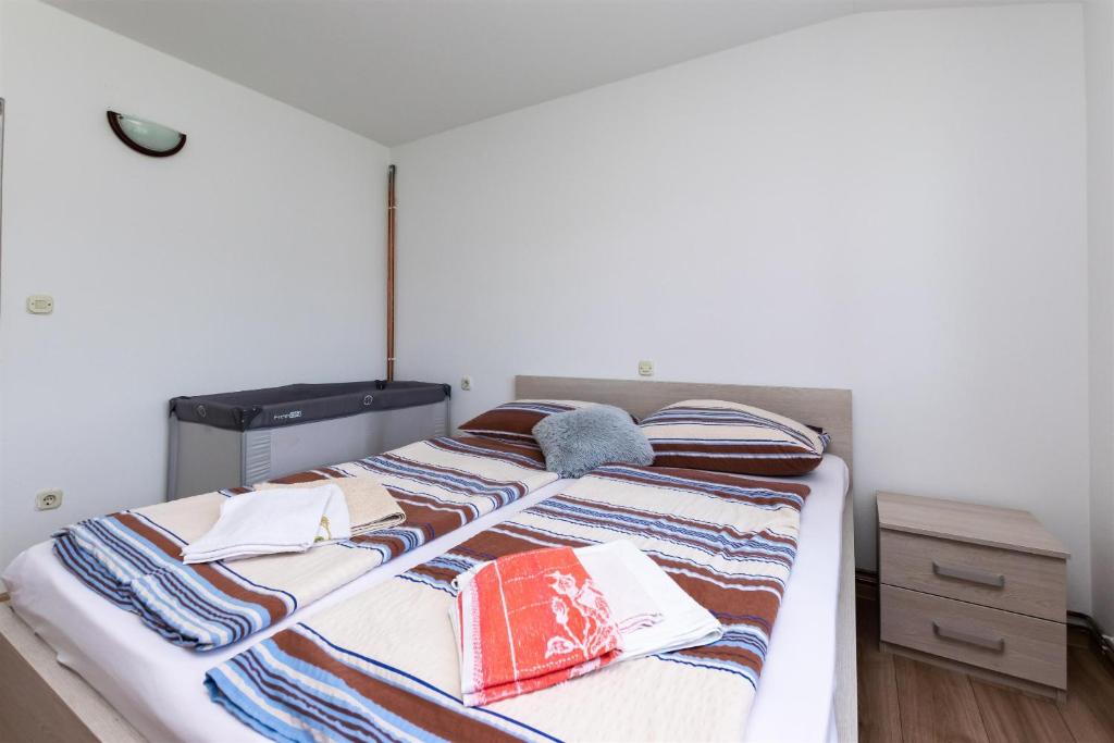 Postel nebo postele na pokoji v ubytování Apartments Boza