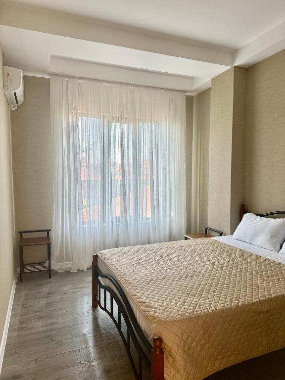 Postel nebo postele na pokoji v ubytování Aparthotel Kutaisi