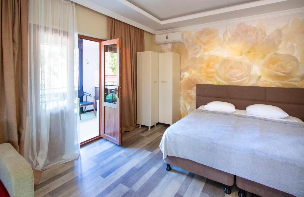 Postel nebo postele na pokoji v ubytování Hotel Smile