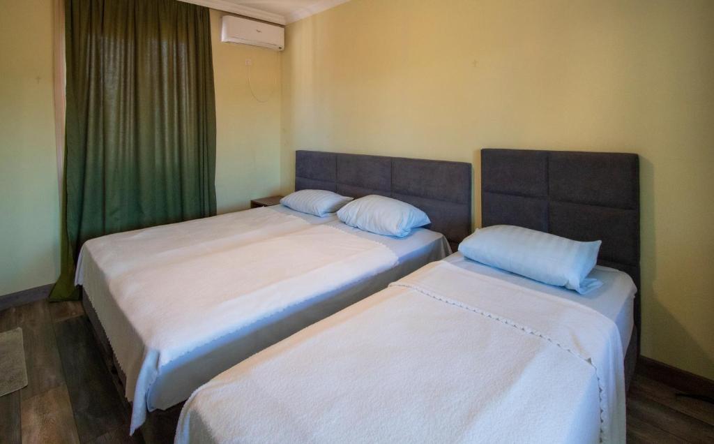 Postel nebo postele na pokoji v ubytování Hotel Smile