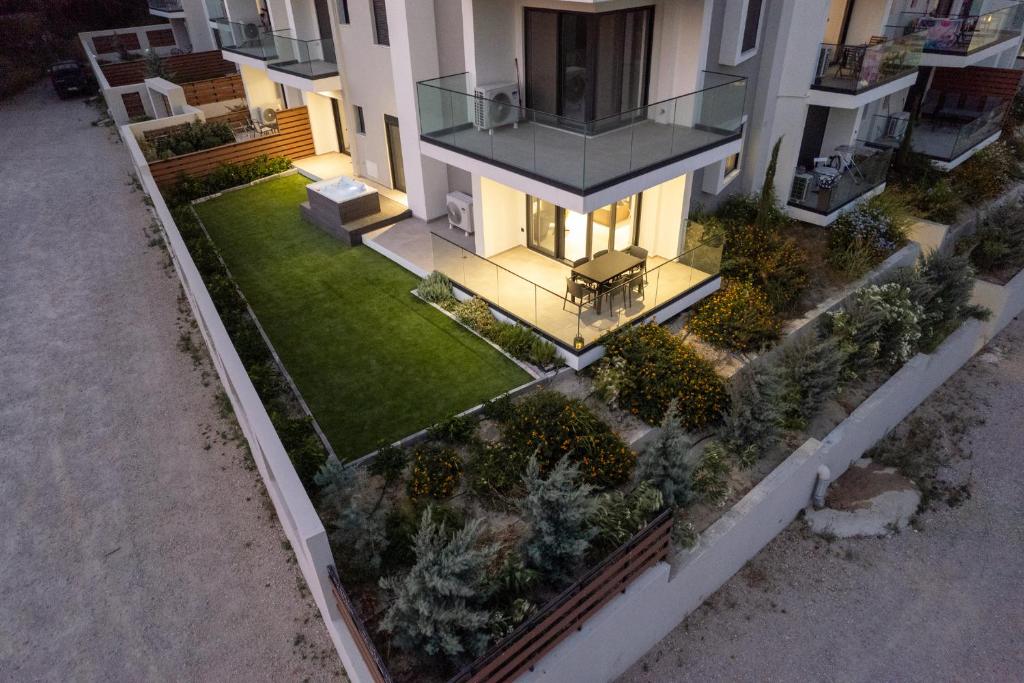 an aerial view of a house with a yard at Maison Du Jardin 2-Bedroom Apartment Private Outdoor Jacuzzi in Rhodes Town