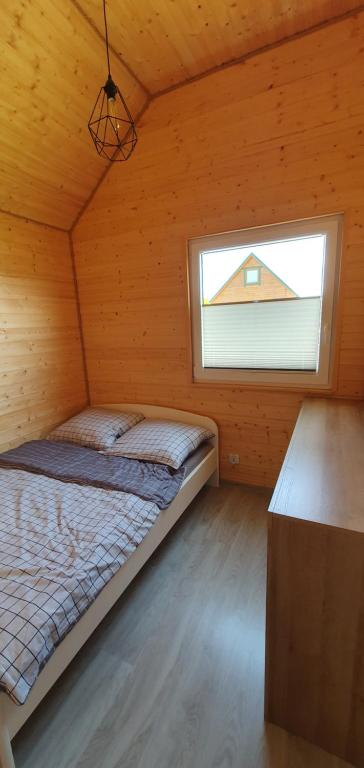 Postel nebo postele na pokoji v ubytování Domki Dafi