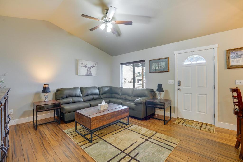 a living room with a couch and a ceiling fan at Laramie Vacation Rental about 4 Mi to Downtown! in Laramie