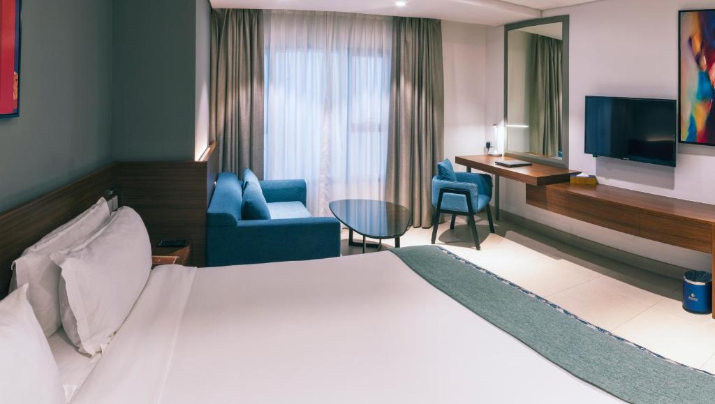 TV a/nebo společenská místnost v ubytování Boulevard Hotel Oman