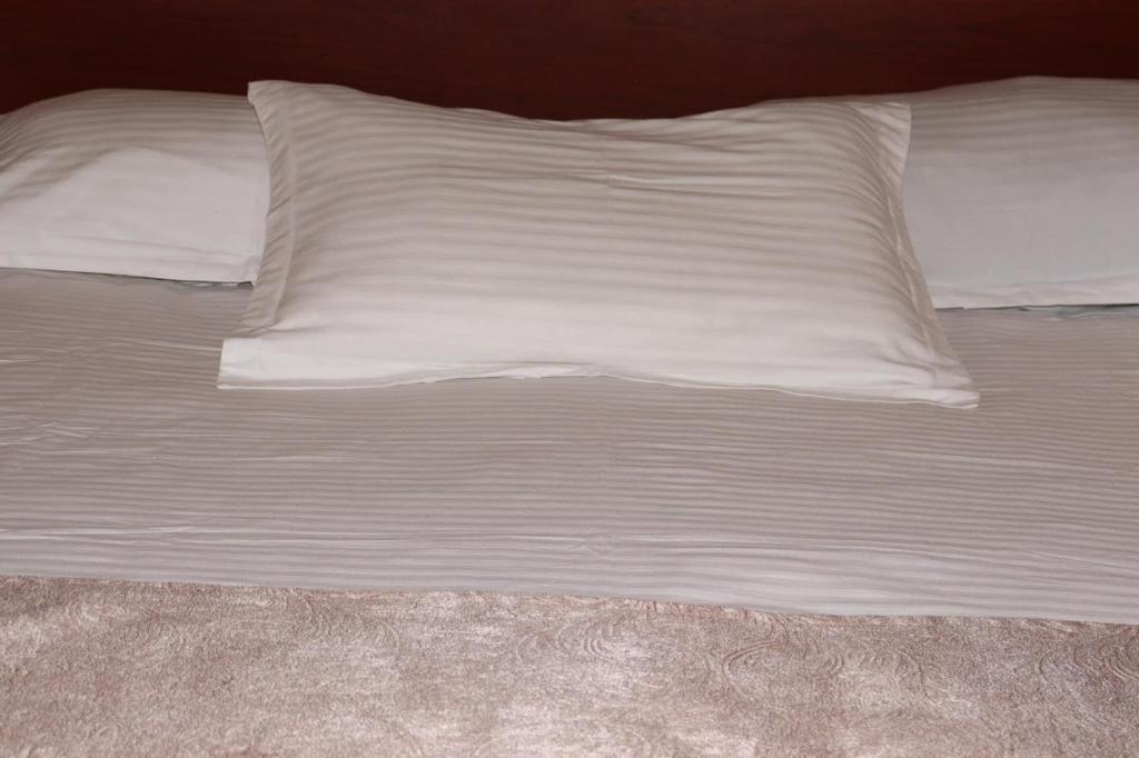 Postel nebo postele na pokoji v ubytování RL Hotel