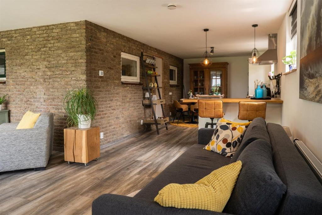 Posezení v ubytování Vakantiewoning Le Garaazje