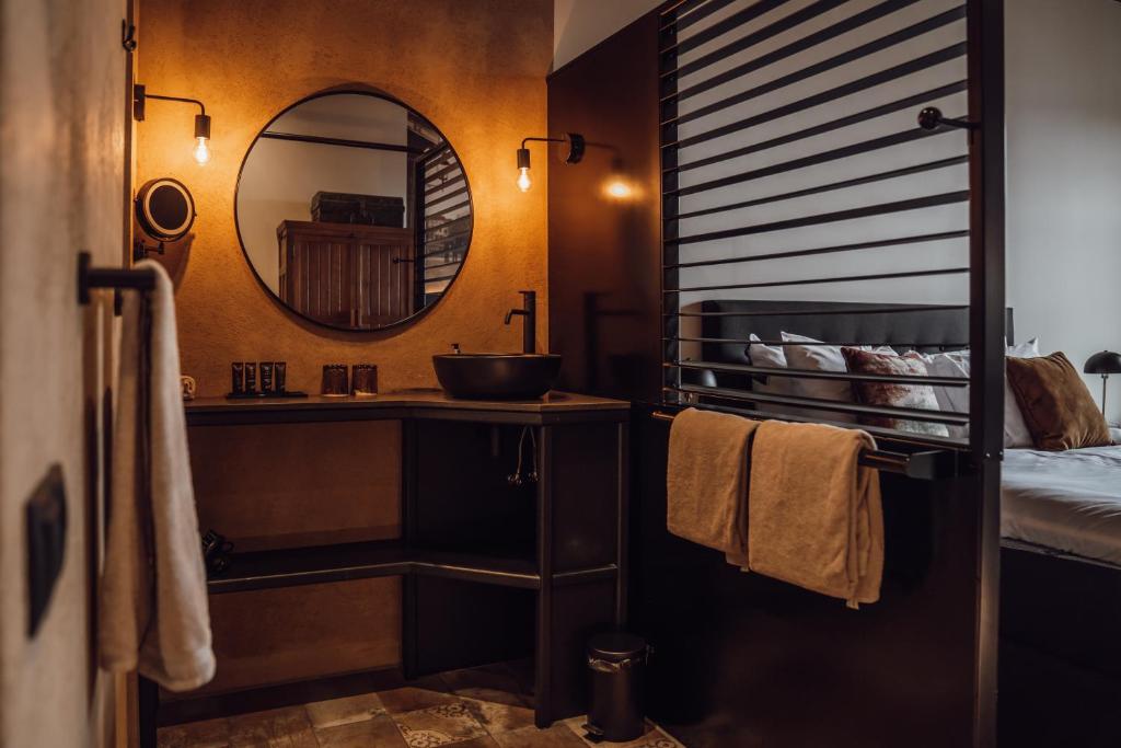 a bathroom with a sink and a mirror at Broederenklooster in Zutphen