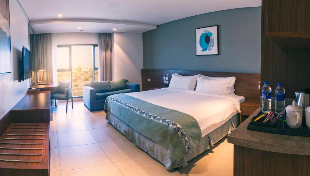 Postel nebo postele na pokoji v ubytování Boulevard Hotel Oman
