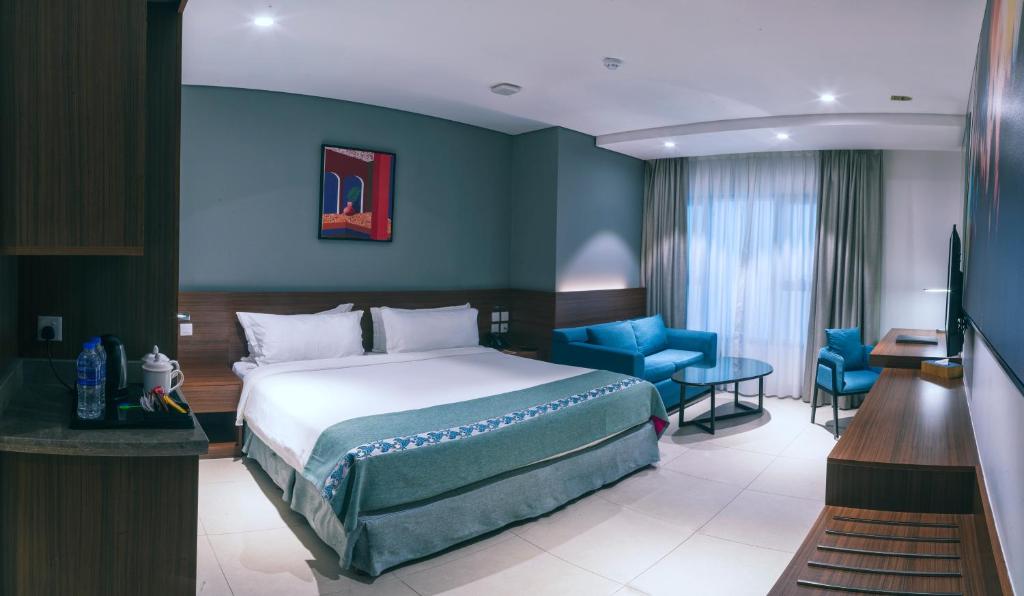 Postel nebo postele na pokoji v ubytování Boulevard Hotel Oman