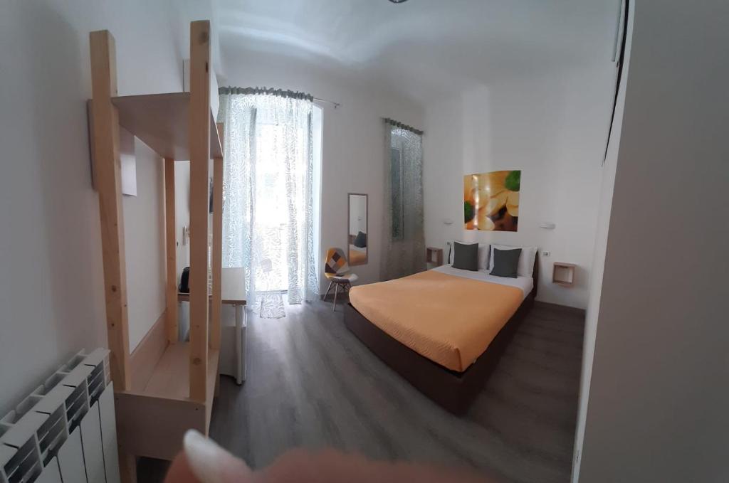Postel nebo postele na pokoji v ubytování Titi Rooms