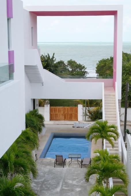 a swimming pool in the middle of a house at An amazing stay in Progreso, close to everything in Progreso