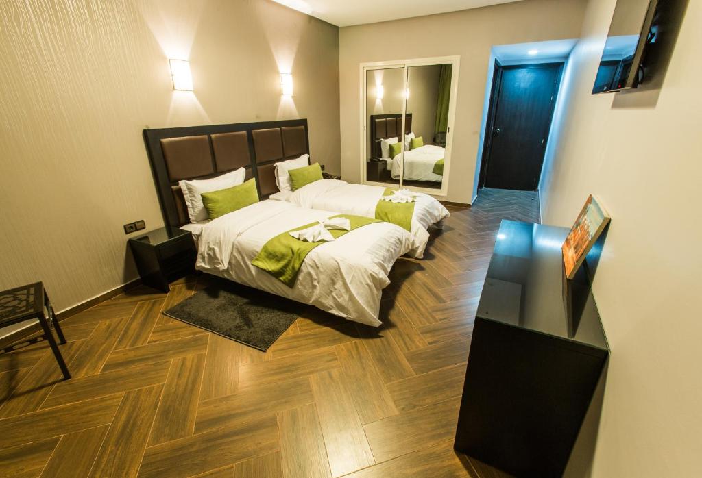 Postel nebo postele na pokoji v ubytování Hotel Swani