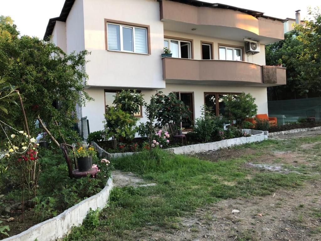 a house with a garden in front of it at Trabzon Blue Sea House in Akcaabat