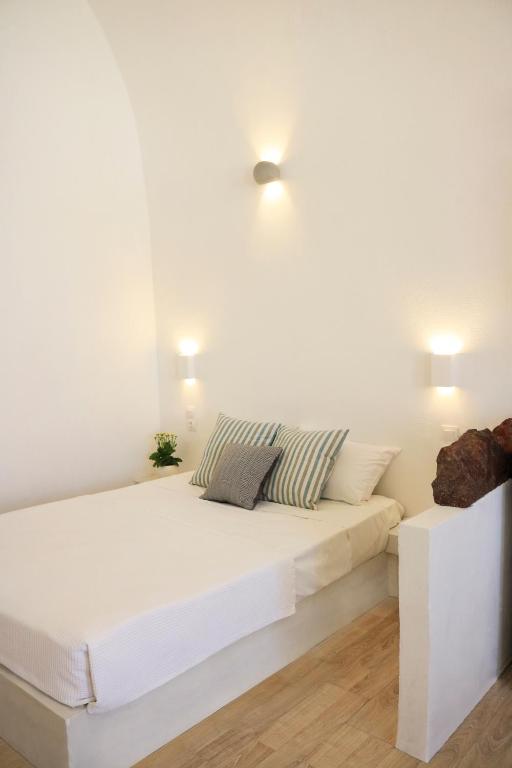 Letto o letti in una camera di Stoa Cave Villas