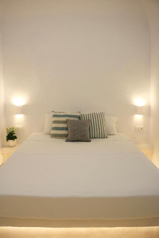 Letto o letti in una camera di Stoa Cave Villas