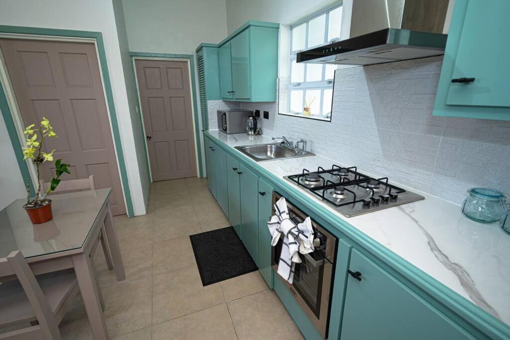 A kitchen or kitchenette at SOHI Villa