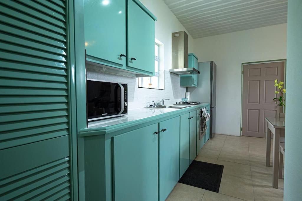 A kitchen or kitchenette at SOHI Villa