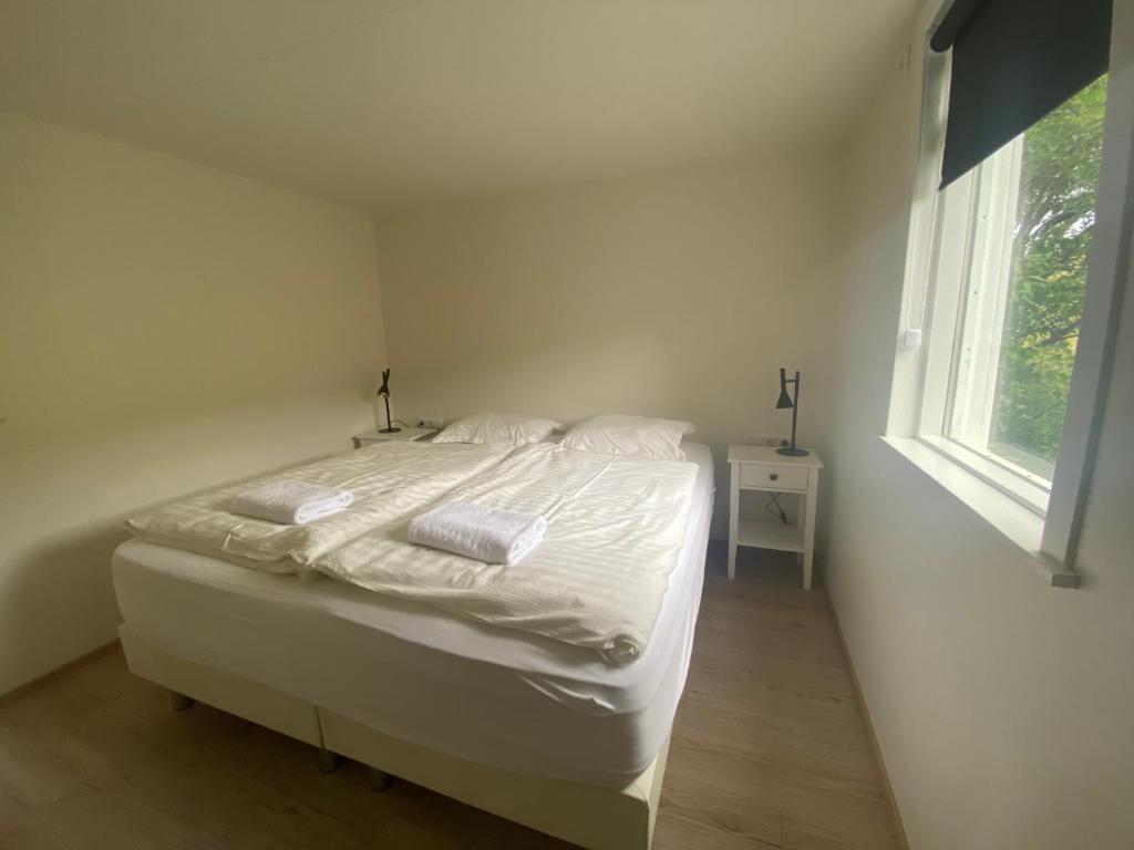 Postel nebo postele na pokoji v ubytování Vallakot Farm Guesthouse