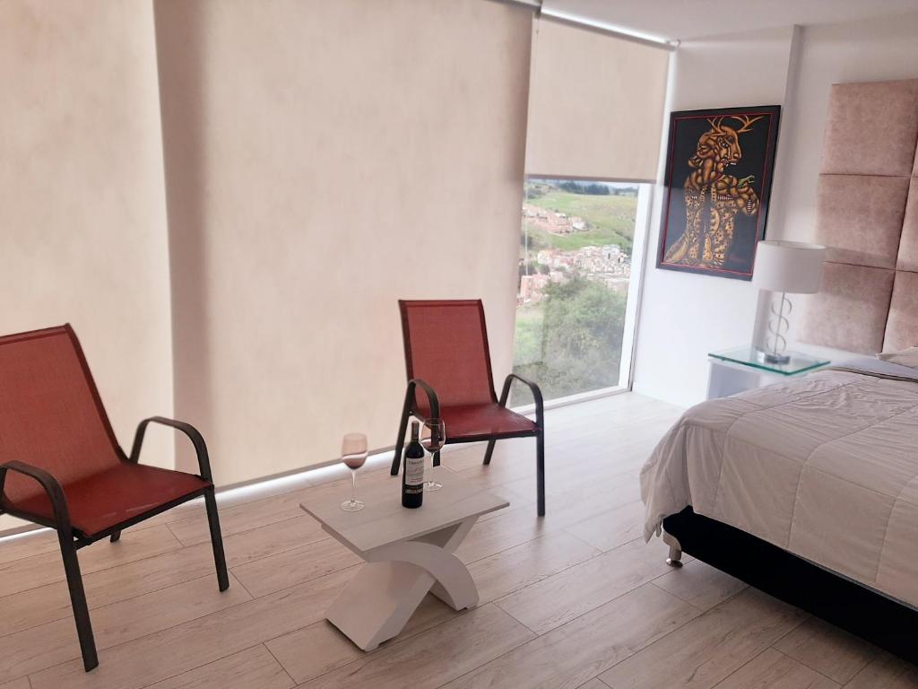 Postel nebo postele na pokoji v ubytování Mirador samsara Suite Luxury piso completo