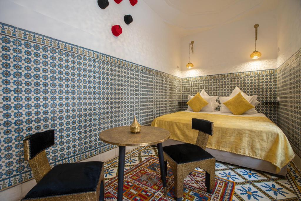 Postel nebo postele na pokoji v ubytování Riad Albaraka